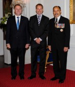 The Governor-General and Rt Hon John Key greet Hon Phil Heatley upon entrance.