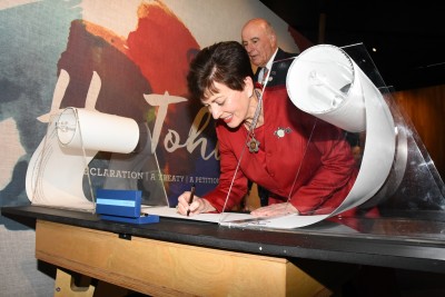 The Governor-General, The Rt Hon Dame Patsy Reddy signing a memorial scroll.
