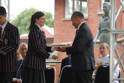 The Governor-General is presented with a gift by Alexandra Kendrick, Senior Girl.