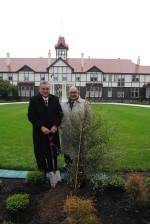 Māori King plants a tree.