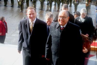 The Prime Minister and Governor-General walk up the steps into Parliament House.