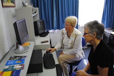 Lady Susan is shown how the new CABNet computer system works by Mary, a Wairarapa CAB volunteer.